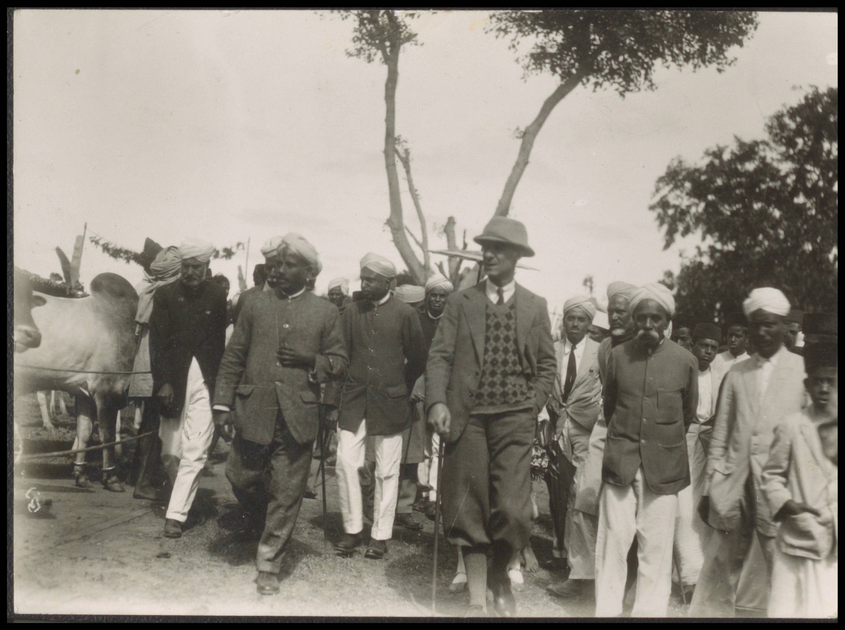 Loose Photos -- Profile photographs of Coleman, field visit, train station, village scene